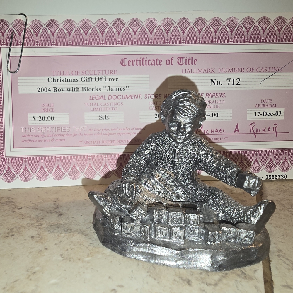 Silver Seated Figure Sculpture with Textural Details
